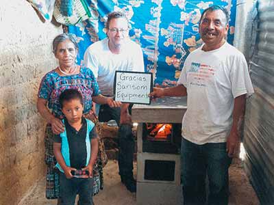 a child and women stand with two men