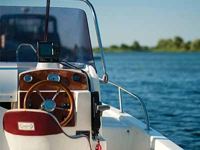 a white boat on a blue ocean