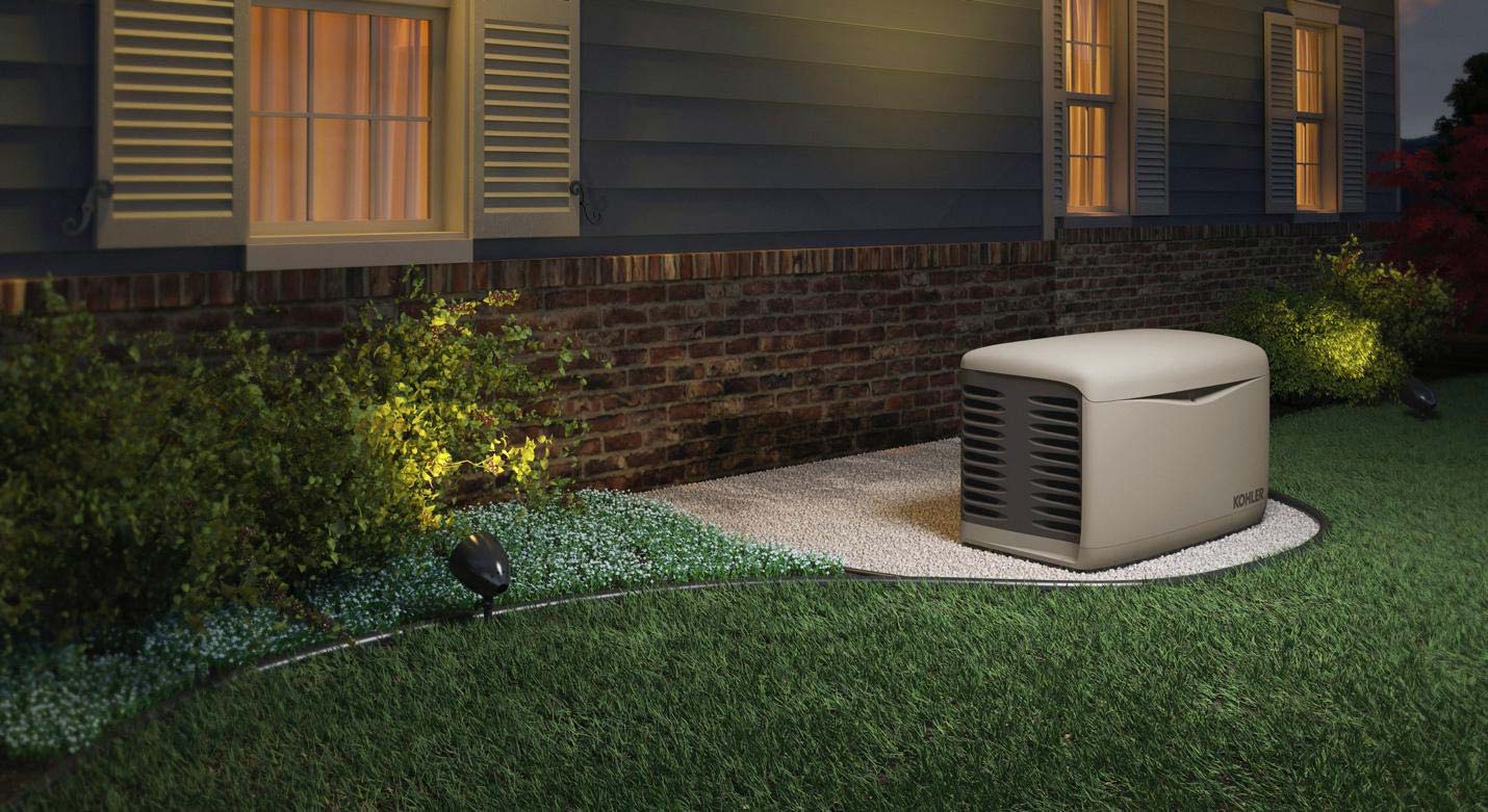 a residential kohler generator installed outside of a house