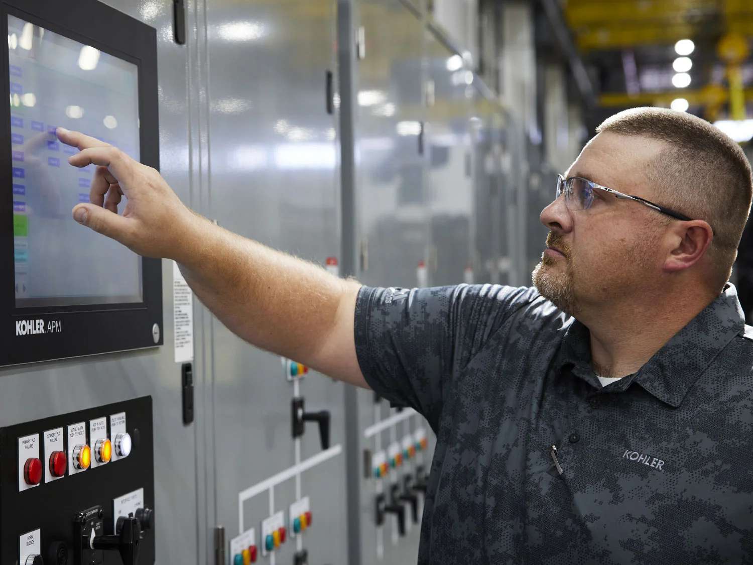 Man working on Automatic transfer switch (ATS) electrical panel